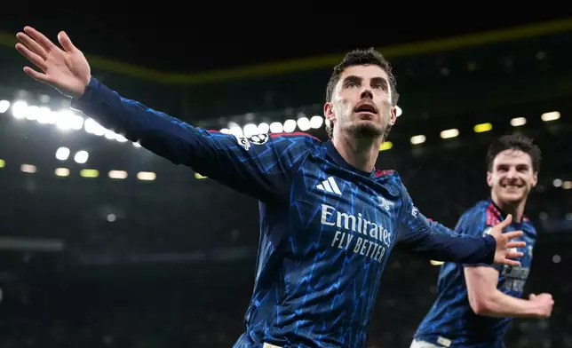 Arsenal's Kai Havertz celebrates after scoring his sides first goal during the Champions League quarterfinals, first leg, soccer match between Sporting CP and Arsenal, in Lisbon, Tuesday, April 7, 2026. (AP Photo/Armando Franca)