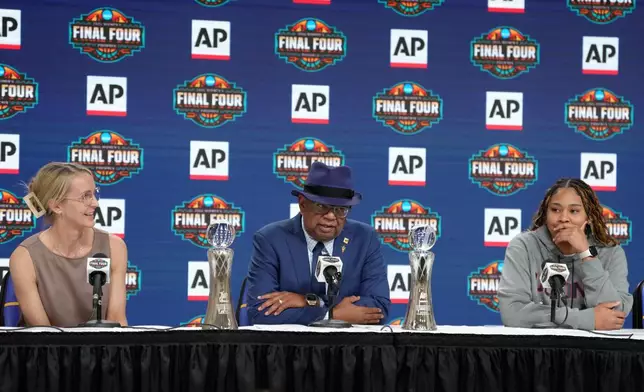Associated Press deputy global sports editor Oscar Dixon, center, talks about Vanderbilt women's basketball head coach Shea Ralph as the 2026 AP Women's Coach of the Year and UConn's Sarah Strong as the 2026 AP Women's Player of the Year, during a news conference at the Women's Final Four of the NCAA college basketball tournament, Thursday, April 2, 2026, in Phoenix. (AP Photo/Ross D. Franklin)