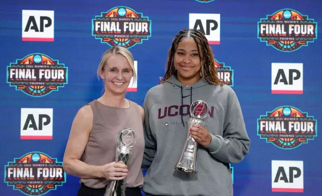Vanderbilt women's basketball head coach Shea Ralph, left, the 2026 AP Women's Coach of the Year and UConn's Sarah Strong, the 2026 AP Women's Player of the Year, pose for photographs during a news conference at the Women's Final Four of the NCAA college basketball tournament, Thursday, April 2, 2026, in Phoenix. (AP Photo/Ross D. Franklin)