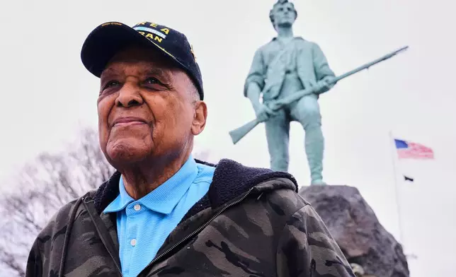 Revolutionary War re-enactor Charles Price, 95, who for decades portrayed enslaved Minuteman Prince Estabrook, poses for a portrait near the Minute Man statue, Monday, April 13, 2026, in Lexington, Mass. (AP Photo/Charles Krupa)