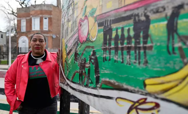 Asiaha Butler, the co-founder of the Resident Association of Greater Englewood, poses for a photo outside her office in Chicago, Monday, April 6, 2026. (AP Photo/Nam Y. Huh)
