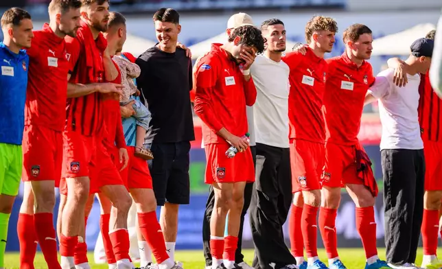 Heidenheim player Eren Dinkçi reacts after the German Bundesliga soccer match between 1. FC Heidenheim and 1. FC St. Pauli in Heidenheim, Germany, on Saturday, April 25, 2026. (Tom Weller/dpa via AP)