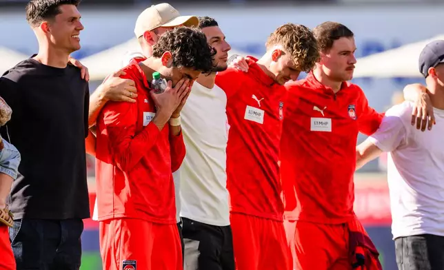 Heidenheim player Eren Dinkçi reacts after the German Bundesliga soccer match between 1. FC Heidenheim and 1. FC St. Pauli in Heidenheim, Germany, on Saturday, April 25, 2026. (Tom Weller/dpa via AP)