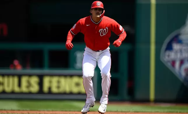 Washington Nationals' Brady House takes a lead from first base during the first inning of a baseball game against the San Francisco Giants, Sunday, April 19, 2026, in Washington. (AP Photo/Nick Wass)