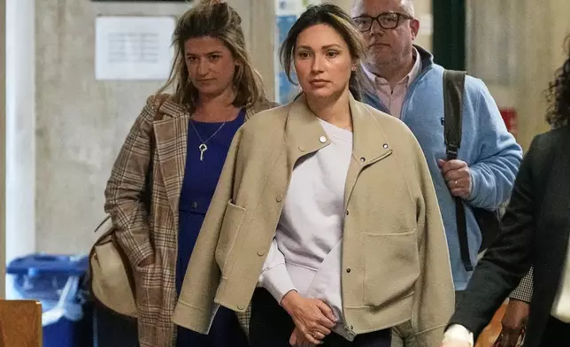Jessica Mann, center, arrives for Harvey Weinstein's trial in criminal court in New York, Monday, April 27, 2026. (AP Photo/Richard Drew)