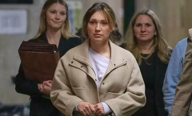 Jessica Mann, center, arrives for Harvey Weinstein's trial in criminal court, followed by Manhattan Assistant District Attorneys Candace White, left, and Nicole Blumberg, in New York, Monday, April 27, 2026. (AP Photo/Richard Drew)