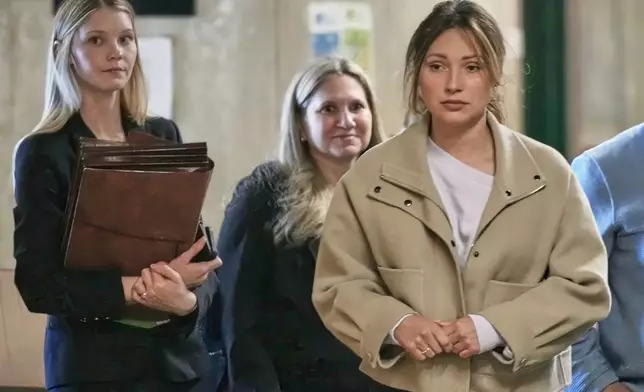 Jessica Mann, right, arrives for Harvey Weinstein's trial in criminal court, followed by Manhattan Assistant District Attorneys Candace White, left, and Nicole Blumberg, in New York, Monday, April 27, 2026. (AP Photo/Richard Drew)