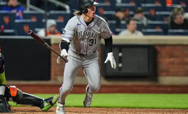Colorado Rockies' Jake McCarthy (31) follows through on a RBI double during the sixth inning of a baseball game against the New York Mets Friday, April 24, 2026, in New York. (AP Photo/Frank Franklin II)