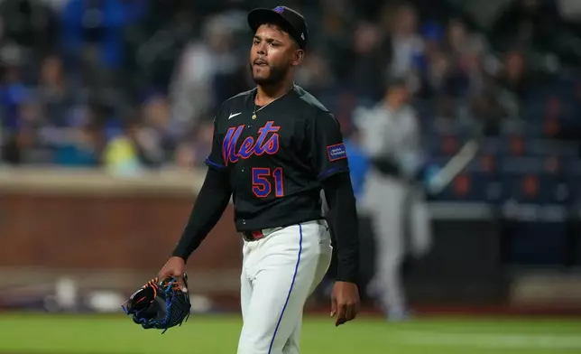 New York Mets pitcher Freddy Peralta (51) leaves during the sixth inning of a baseball game against the Colorado Rockies Friday, April 24, 2026, in New York. (AP Photo/Frank Franklin II)