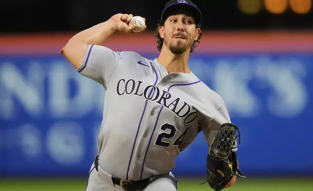 Colorado Rockies' Michael Lorenzen (24) pitches during the second inning of a baseball game against the New York Mets Friday, April 24, 2026, in New York. (AP Photo/Frank Franklin II)