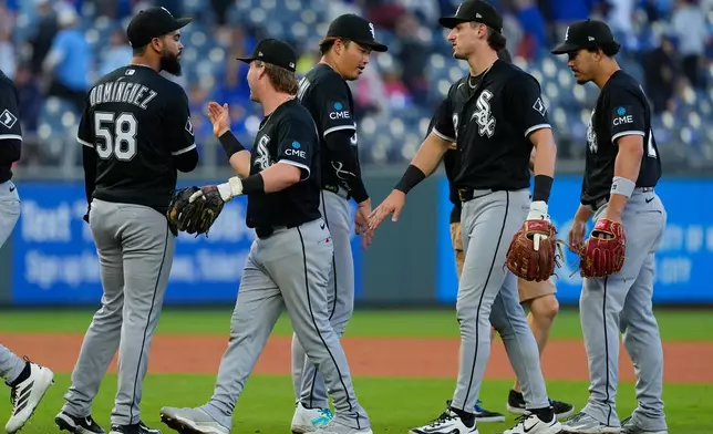 Chicago White Sox players celebrate after their baseball game against the Kansas City Royals, Sunday, April 12, 2026, in Kansas City, Mo. (AP Photo/Charlie Riedel)