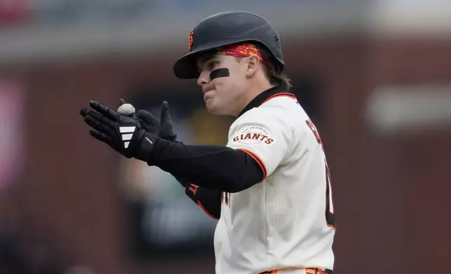 San Francisco Giants' Drew Gilbert gestures after hitting an RBI single during the sixth inning of a baseball game against the Miami Marlins Sunday, April 26, 2026, in San Francisco. (AP Photo/Jeff Chiu)