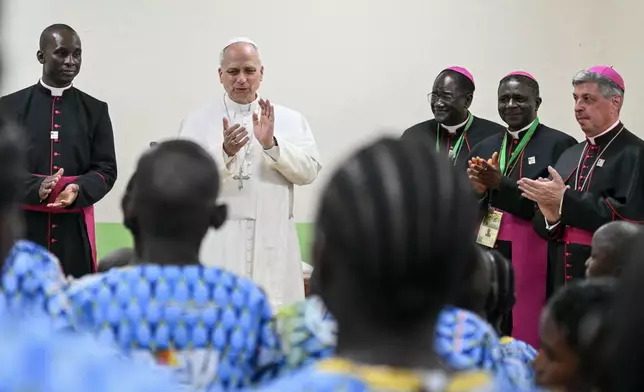 Pope Leo XIV claps hands as he visits the Ngul Zamba (Power of God) orphanage in Yaounde, Cameroon, Wednesday April 15, 2026 on the third day of his apostolic journey to Africa. (Alberto Pizzoli, Pool Photo via AP)