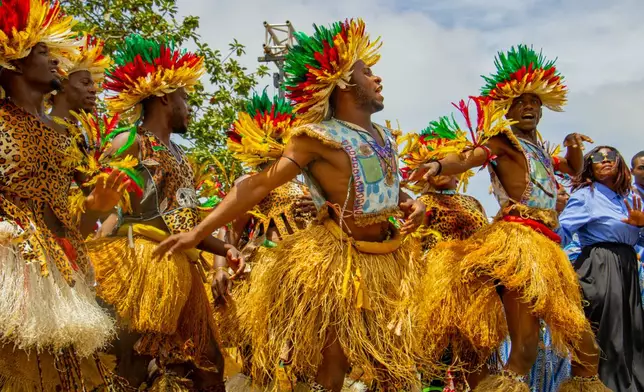 Dancers performs before the arrival of Pope Leo XIV at the Yaounde Nsimalen International Airport in Yaounde, Cameroon, Wednesday, April 15, 2026. (AP Photo/Welba Yamo Pascal)