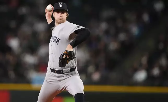New York Yankees starting pitcher Cam Schlittler throws against the Seattle Mariners during the first inning of a baseball game, Wednesday, April 1, 2026, in Seattle. (AP Photo/Lindsey Wasson)