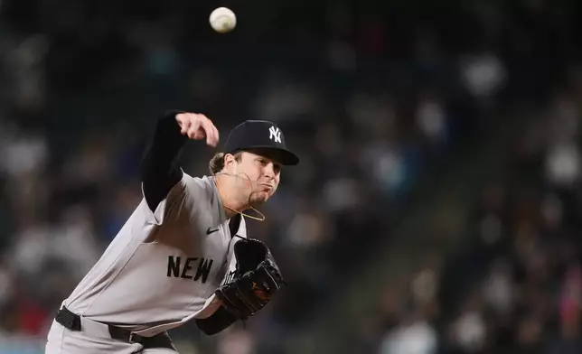 New York Yankees starting pitcher Cam Schlittler throws against the Seattle Mariners during the first inning of a baseball game, Wednesday, April 1, 2026, in Seattle. (AP Photo/Lindsey Wasson)