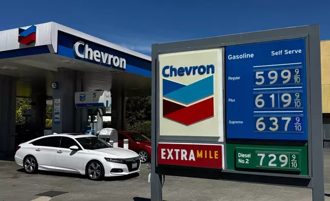 A Chevron gas station in Alameda, Calif. displays gas prices on March 23, 2026. (AP Photo/Terry Chea)