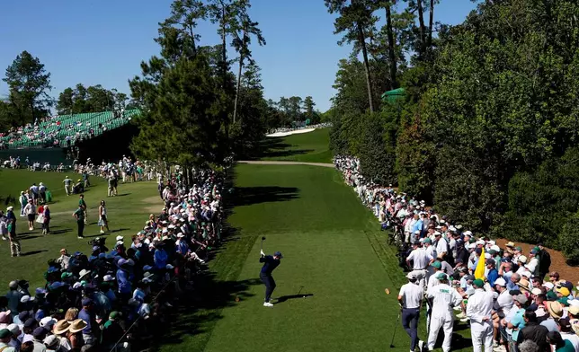 Rory McIlroy, of Northern Ireland, hits his tee shot on the 18th hole during the first round of the Masters golf tournament at the Augusta National Golf Club, Thursday, April 9, 2026, in Augusta, Ga. (AP Photo/David J. Phillip)