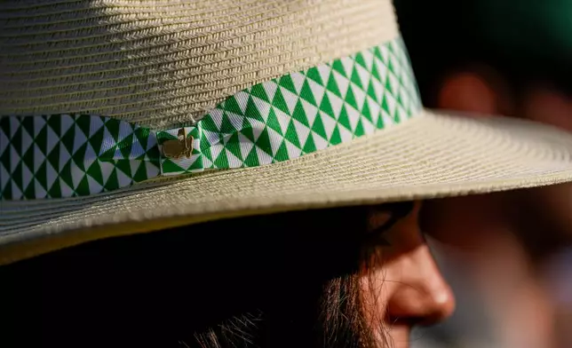 A patron watches during the second round of the Masters golf tournament at the Augusta National Golf Club, Friday, April 10, 2026, in Augusta, Ga. (AP Photo/Ashley Landis)
