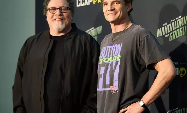 Jon Favreau, left, and Pedro Pascal pose for photos at CCXP Mexico in Mexico City, Sunday, April 26, 2026. (AP Photo/Ginnette Riquelme)