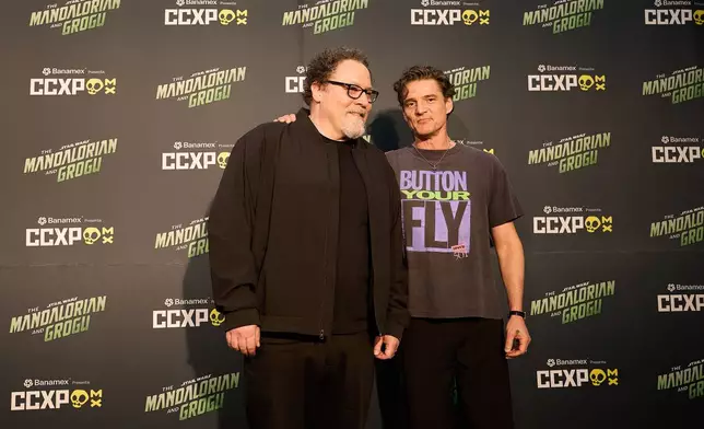 Jon Favreau, left, and Pedro Pascal pose for photos at CCXP Mexico in Mexico City, Sunday, April 26, 2026. (AP Photo/Ginnette Riquelme)