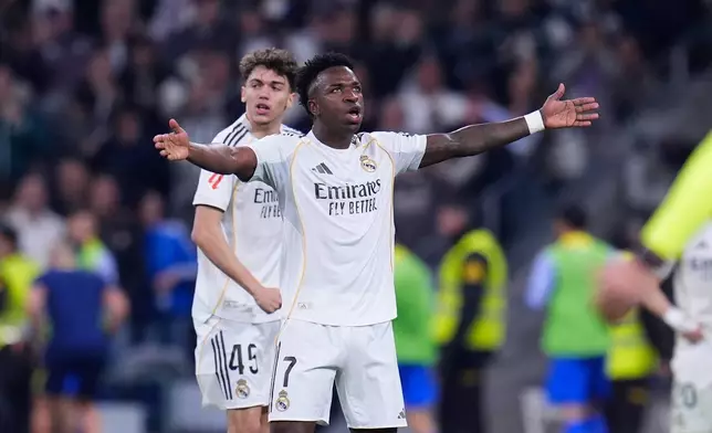 Real Madrid's Vinicius Junior celebrates after scoring his side's first goal the Spanish La Liga soccer match between Real Madrid and Atletico Madrid in Madrid, Spain, Sunday, March 22, 2026. (AP Photo/Manu Fernandez)