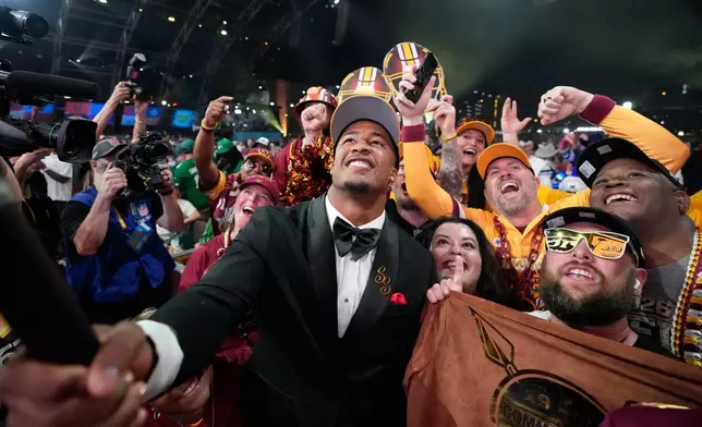 Ohio State linebacker Sonny Styles celebrates with fans after being chosen by the Washington Commanders with the seventh overall pick during the first round of the NFL football draft, Thursday, April 23, 2026, in Pittsburgh. (AP Photo/Sue Ogrocki)