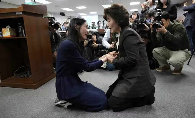FILE - Truth and Reconciliation Commission Chairperson Park Sun Young, right, comforts adoptee Yooree Kim during a press conference in Seoul, South Korea, March 26, 2025. (AP Photo/Ahn Young-joon, File)