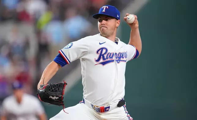 Texas Rangers starting pitcher MacKenzie Gore throws a pitch to the Cincinnati Reds during the second inning of the Rangers' home-opener baseball game Friday, April 3, 2026, in Arlington, Texas. (AP Photo/Julio Cortez)