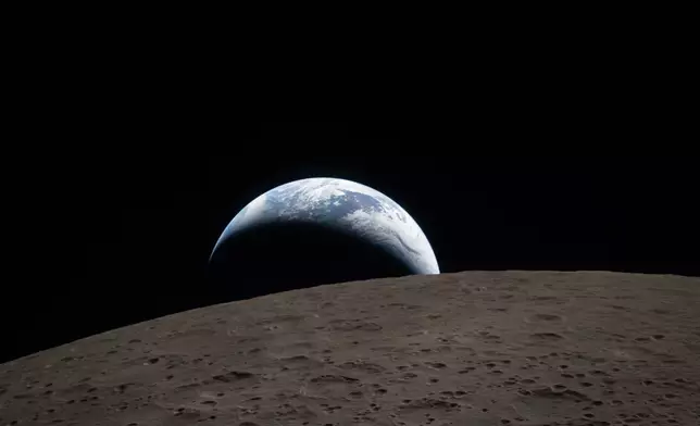 In this image provided by NASA, The Artemis II crew captured this view of an Earthset on Monday, April 6, 2026, as they flew around the Moon. (NASA via AP)