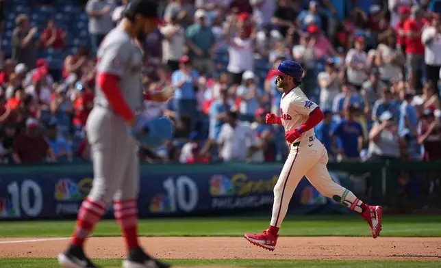 Philadelphia Phillies' Bryce Harper runs the basses after hitting a home run off of Philadelphia Phillies' Seth Johnson during the eighth inning of a baseball game, Wednesday, April 1, 2026, in Philadelphia. (AP Photo/Matt Rourke)