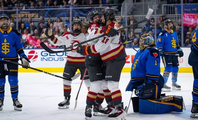 Ottawa Charge forward Brianne Jenner (19) celebrates with teammates after her goal against Toronto Sceptres goaltender Raygan Kirk (1) during third-period PWHL hockey game action in Toronto, Saturday, April 11, 2026. (Arlyn McAdorey/The Canadian Press via AP)