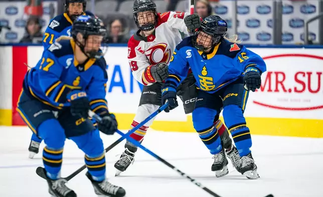 Ottawa Charge forward Peyton Hemp (29) collides with Toronto Sceptres' Savannah Harmon (15) during the first period of aPWHL hockey game in Toronto, Saturday, April 11, 2026. (Arlyn McAdorey/The Canadian Press via AP)