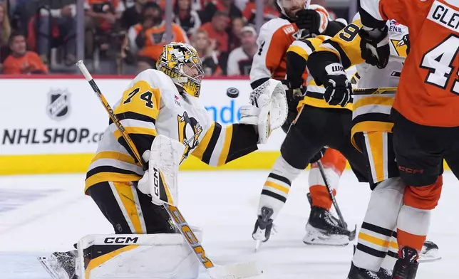Pittsburgh Penguins' Stuart Skinner cannot stop a goal by Philadelphia Flyers' Nick Seeler during the second period of Game 3 in the first round of the NHL Stanley Cup hockey playoffs Wednesday, April 22, 2026, in Philadelphia. (AP Photo/Matt Slocum)