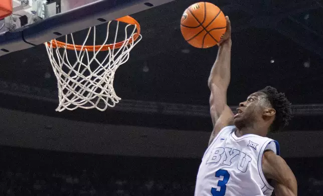 FILE - BYU forward AJ Dybantsa (3) prepares to dunk the ball against Eastern Washington during the first half of an NCAA college basketball game, Monday, Dec. 22, 2025, in Provo, Utah. (AP Photo/Rob Gray, File)
