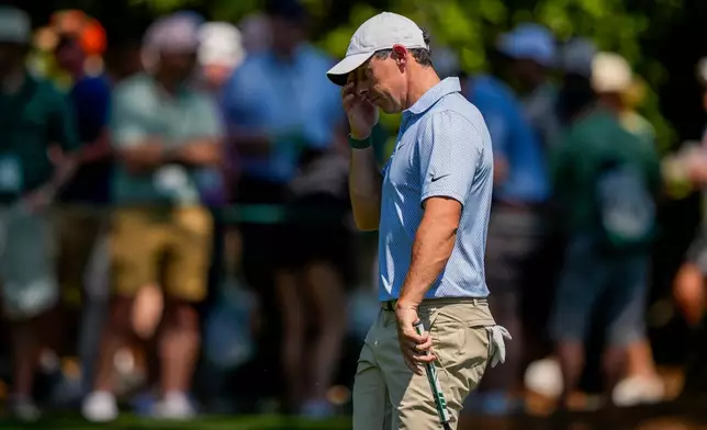 Rory McIlroy, of Northern Ireland, walks to green on the first hole during the final round of the Masters golf tournament at the Augusta National Golf Club, Sunday, April 12, 2026, in Augusta, Ga. (AP Photo/Matt Slocum)