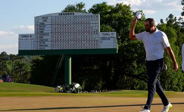 Scottie Scheffler finishes his final round of the Masters golf tournament at the Augusta National Golf Club, Sunday, April 12, 2026, in Augusta, Ga. (AP Photo/David J. Phillip)