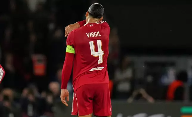 Liverpool's Virgil van Dijk stands on the pitch after the Champions League quarterfinal first leg soccer match between Paris Saint-Germain and Liverpool in Paris, Wednesday, April 8, 2026. (AP Photo/Aurelien Morissard)