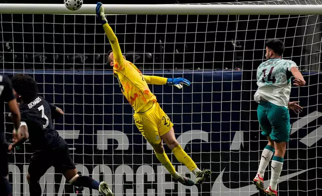 USA goalkeeper Matt Freese(24) makes a save against Portugal during the first half of an international friendly soccer match, Tuesday, March 31, 2026, in Atlanta. (AP Photo/Mike Stewart)