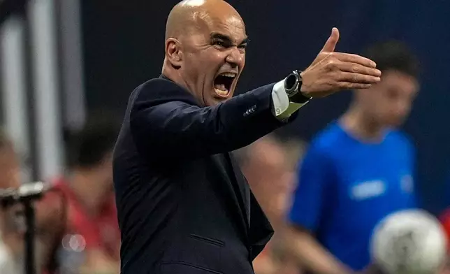Portugal's coach Roberto Martinez speaks during the first half of an international friendly soccer match against team USA, Tuesday, March 31, 2026, in Atlanta. (AP Photo/Mike Stewart)