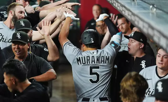Chicago White Sox's Munetaka Murakami (5), of Japan, celebrates his two-run home run against the Arizona Diamondbacks during the seventh inning of a baseball game, Wednesday, April 22, 2026, in Phoenix. (AP Photo/Ross D. Franklin)