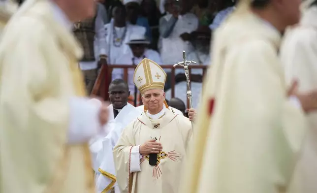 Pope Leo XIV arrives in procession to celebrate Mass at the Japoma Stadium, in Douala, Cameroon, Friday, April 17, 2026 on the fifth day of his 11-day pastoral visit to Africa. (AP Photo/Andrew Medichini)