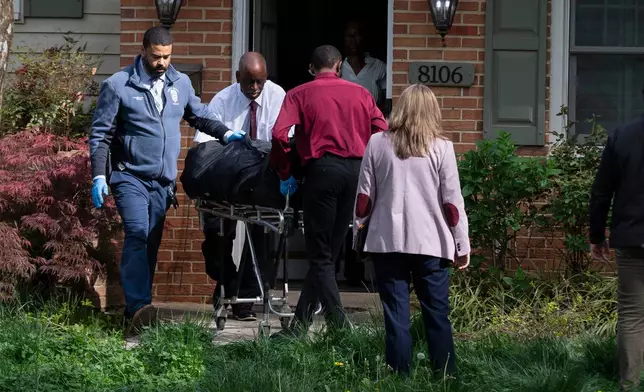 Fairfax County coroners remove a body from the home of former Virginia Lt. Gov. Justin Fairfax, in Annandale, Va., Thursday, April 16, 2026. (AP Photo/Cliff Owen)