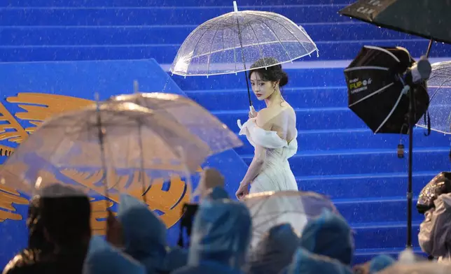 Zhou Jieqiong arrives for the red carpet of the 16th Beijing International Film Festival held in Beijing, Thursday, April 16, 2026. (AP Photo/Ng Han Guan)