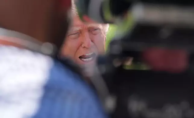 President Donald Trump speaks with reporters before departing on Marine One from the South Lawn of the White House, Thursday, April 16, 2026, in Washington. (AP Photo/Jen Golbeck)