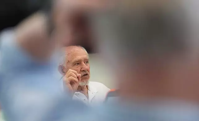 Rafael Montalvo, president of the Brigade 2506 Veterans Association, speaks with other Bay of Pigs Invasion veterans and relatives during a planning meeting for the reopening of the Bay of Pigs Museum in a new and larger space in Miami's Little Havana neighborhood, Tuesday, April 7, 2026. (AP Photo/Rebecca Blackwell)