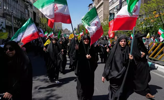 Government supporters gather to mark the 40th day since the death of Supreme Leader Ayatollah Ali Khamenei in Tehran, Iran, Thursday, April 9, 2026. (AP Photo/Vahid Salemi)