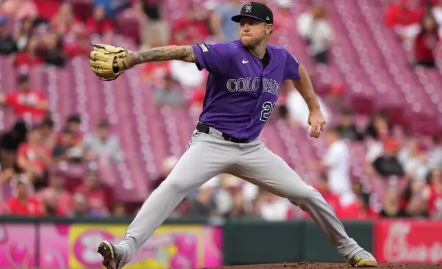 Colorado Rockies' Kyle Freeland delivers a pitch during the first inning of a baseball game against the Cincinnati Reds, Tuesday, April 28, 2026, in Cincinnati. (AP Photo/Kareem Elgazzar)