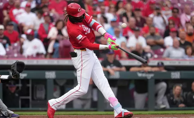 Cincinnati Reds' Elly de la Cruz hits a single during the first inning of a baseball game against the Colorado Rockies', Tuesday, April 28, 2026, in Cincinnati. (AP Photo/Kareem Elgazzar)