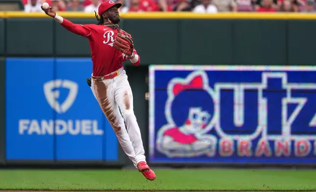 Cincinnati Reds shortstop Elly de la Cruz throws to first base for a out of Colorado Rockies' Kyle Karros (not shown) during the second inning of a baseball game against the Colorado Rockies', Tuesday, April 28, 2026, in Cincinnati. (AP Photo/Kareem Elgazzar)